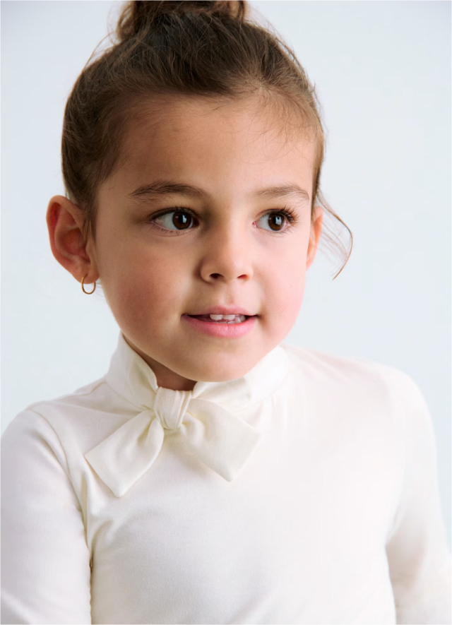 Cream Turtleneck with Bow Tie